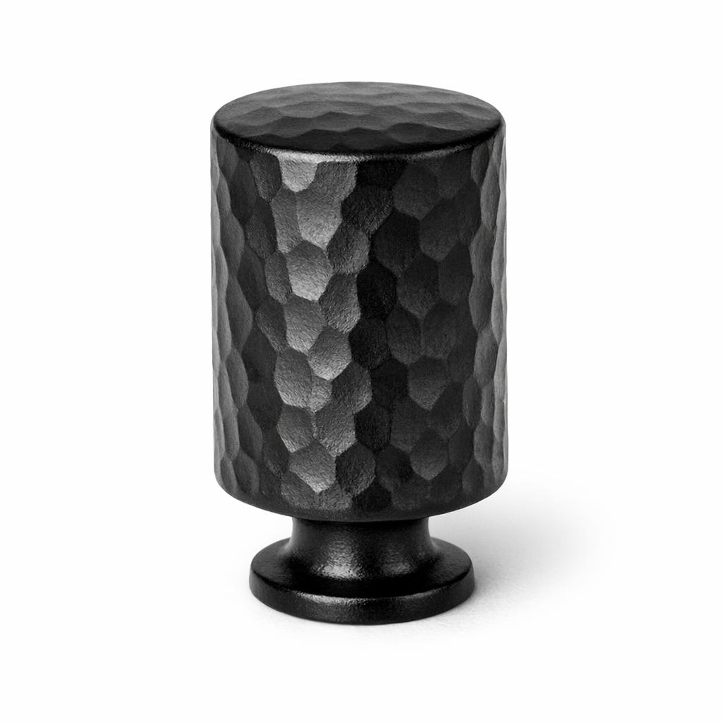 Commercial product photograph. A single residential cabinet knob. Hammered surface texture. Round Knob shap...