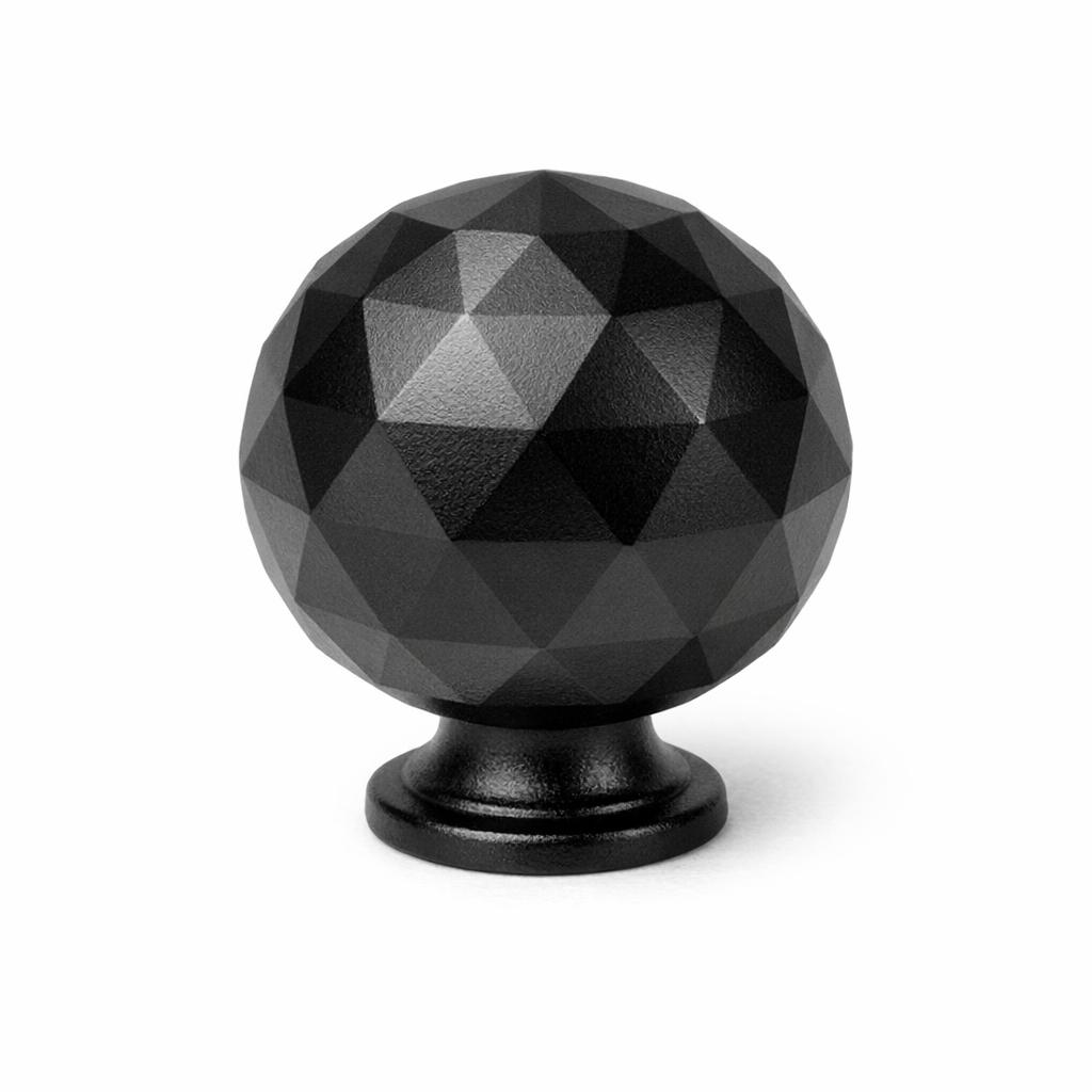 Commercial product photograph. A single residential cabinet knob. Faceted surface texture. Round Knob shape. Matte Black metal finish. Small circular base plate, single mounting post, approximately 1-1/4 inch diameter. Photographed on pure white seamless background (#FFFFFF). Studio softbox lighting, soft shadow directly underneath only. Macro lens, sharp focus throughout. Photorealistic real metal hardware. Not a 3D render. Not an illustration. Not CGI. Real cabinet hardware product photography quality. Variation 3: Globe style cabinet knob: a sphere cut into many flat triangular facets like a disco ball or cut gemstone, faceted all over, small narrow base ring..