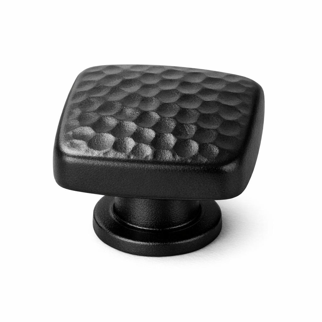 Commercial product photograph. A single residential cabinet knob. Hammered surface texture. Round Kn