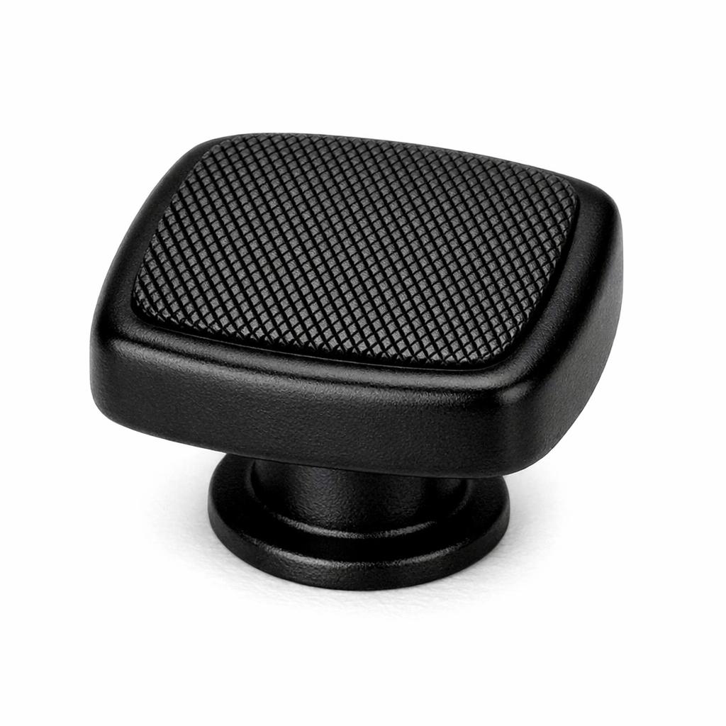 Commercial product photograph. A single residential cabinet knob. Knurled surface texture. Round Kno