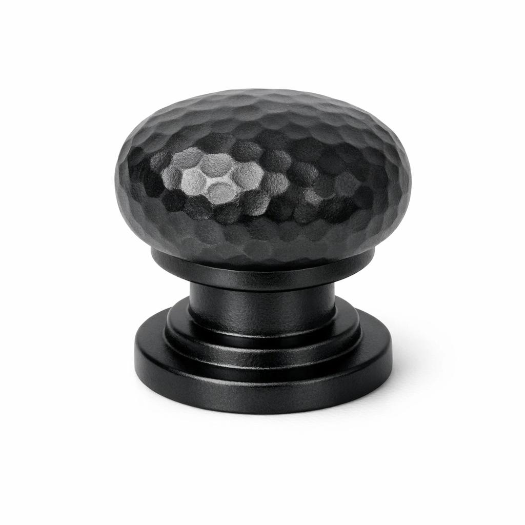 Commercial product photograph. A single residential cabinet knob. Hammered surface texture. Round Knob shap...