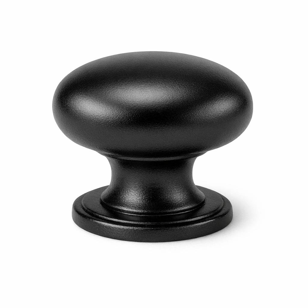 Commercial product photograph. A single residential cabinet knob. Smooth surface texture. Round Knob shape. Matte Black metal finish. Small circular base plate, single mounting post, approximately 1-1/4 inch diameter. Photographed on pure white seamless background (#FFFFFF). Studio softbox lighting, soft shadow directly underneath only. Macro lens, sharp focus throughout. Photorealistic real metal hardware. Not a 3D render. Not an illustration. Not CGI. Real cabinet hardware product photography quality. Variation 1: Traditional mushroom knob: wide rounded dome top, short thick neck, circular base plate with beveled edge. Classic kitchen hardware style..