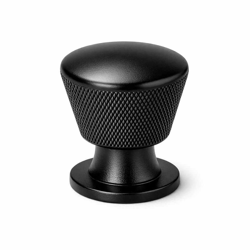 Commercial product photograph. A single residential cabinet knob. Knurled surface texture. Round Knob shape...