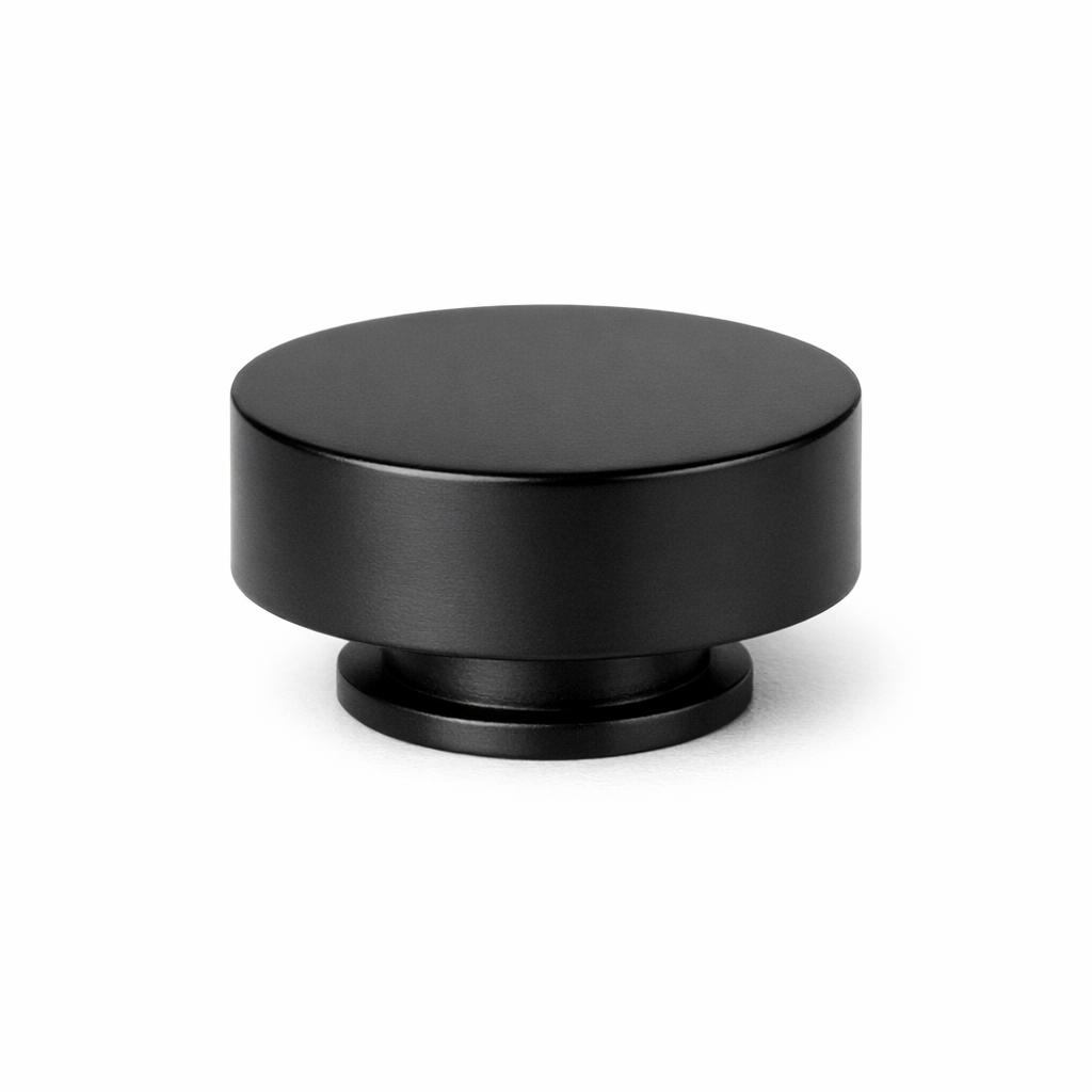 Commercial product photograph. A single residential cabinet knob. Smooth surface texture. Round Knob shape....