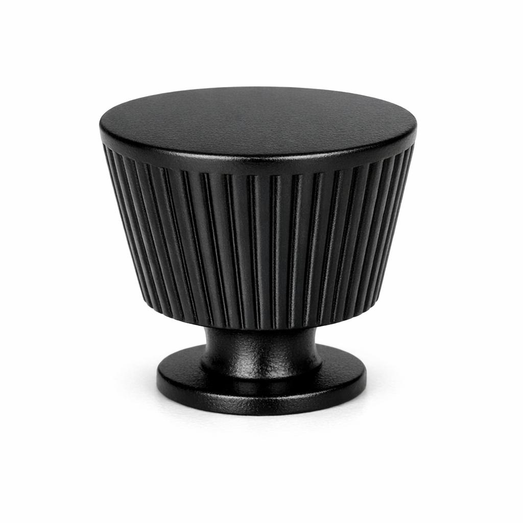 Commercial product photograph. A single residential cabinet knob. Ribbed surface texture. Round Knob shape. Matte Black 