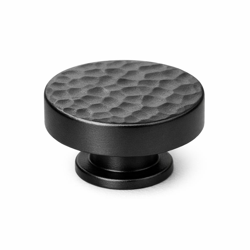 Commercial product photograph. A single residential cabinet knob. Hammered surface texture. Round Knob shap...