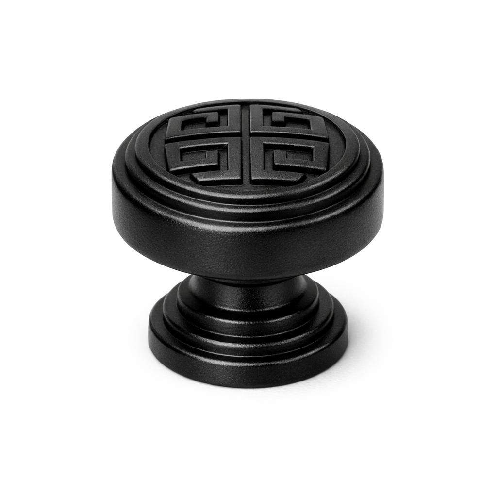 Commercial product photograph. A single residential cabinet knob. Geometric surface texture. Round K
