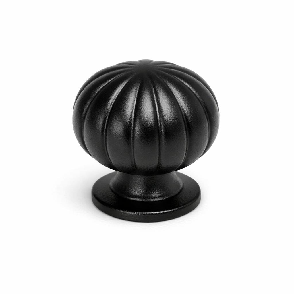 Commercial product photograph. A single residential cabinet knob. Smooth surface texture. Round Knob shape. Matte Black 