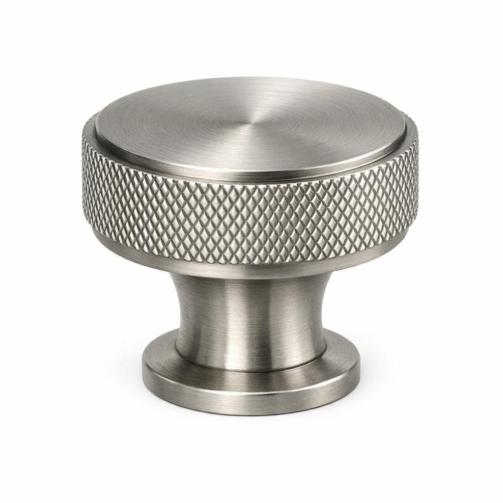 A single product photograph of a Knurled Round Knob cabinet knob in Brushed Nickel finish. Shot straight-on...