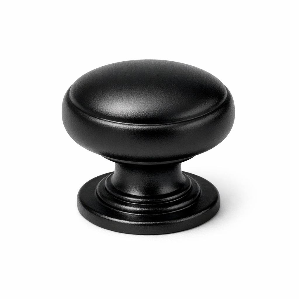 Commercial product photograph. A single residential cabinet knob. Smooth surface texture. Round Knob shape. Matte Black 