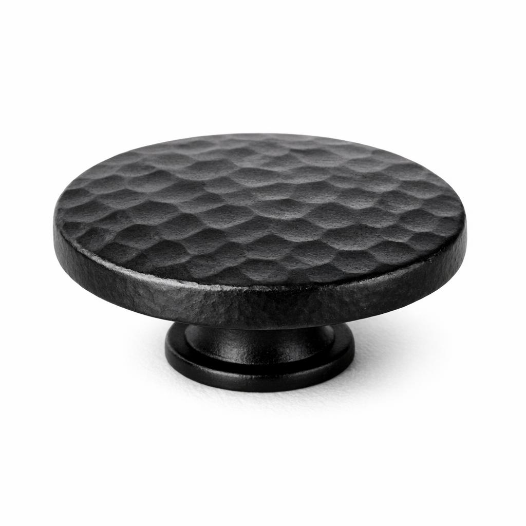 Commercial product photograph. A single residential cabinet knob. Hammered surface texture. Round Knob shap...