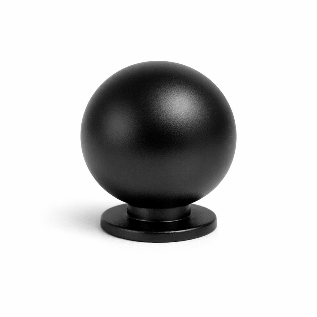 Commercial product photograph. A single residential cabinet knob. Smooth surface texture. Round Knob shape....