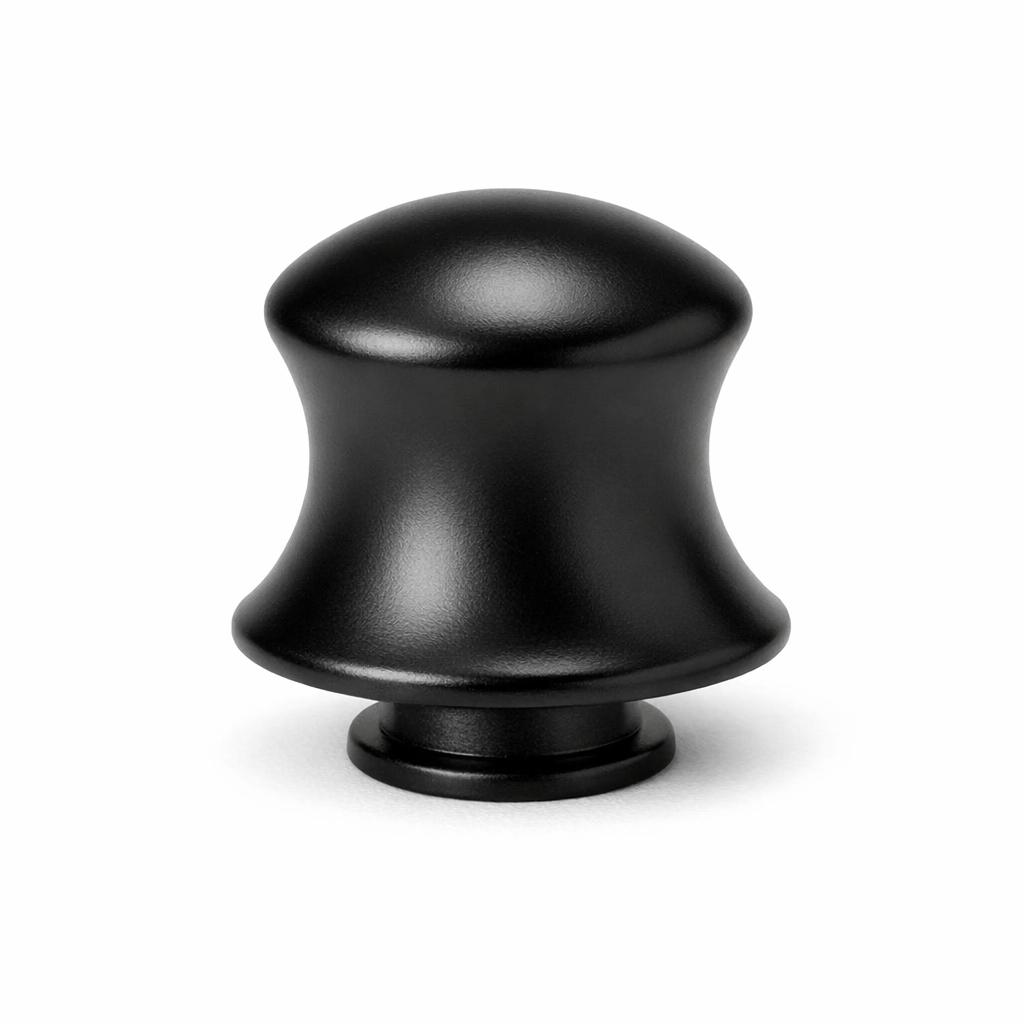Commercial product photograph. A single residential cabinet knob. Smooth surface texture. Round Knob shape. Matte Black 