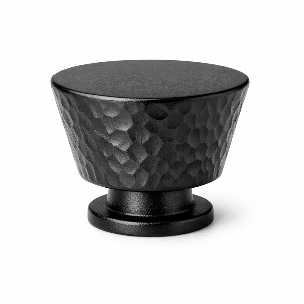 Commercial product photograph. A single residential cabinet knob. Hammered surface texture. Round Knob shap...