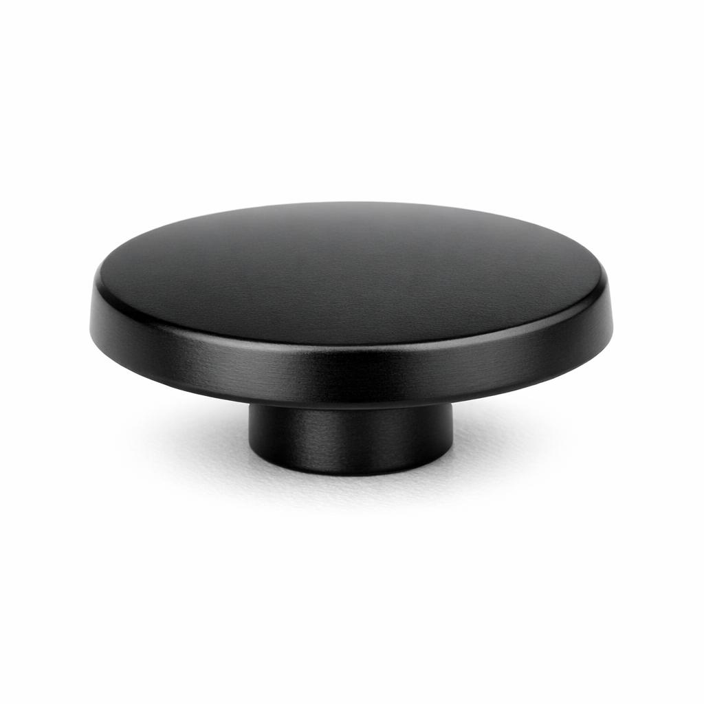 Commercial product photograph. A single residential cabinet knob. Smooth surface texture. Round Knob shape....