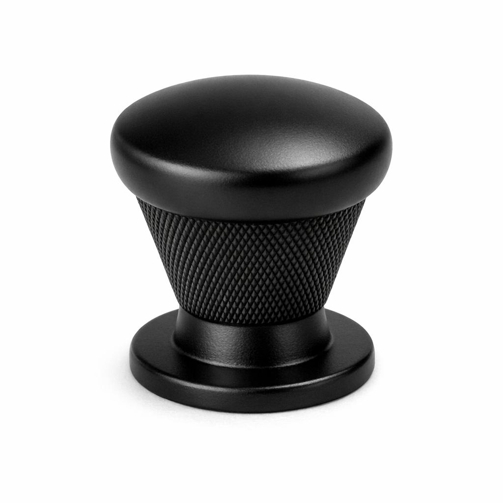 Commercial product photograph. A single residential cabinet knob. Knurled surface texture. Round Kno