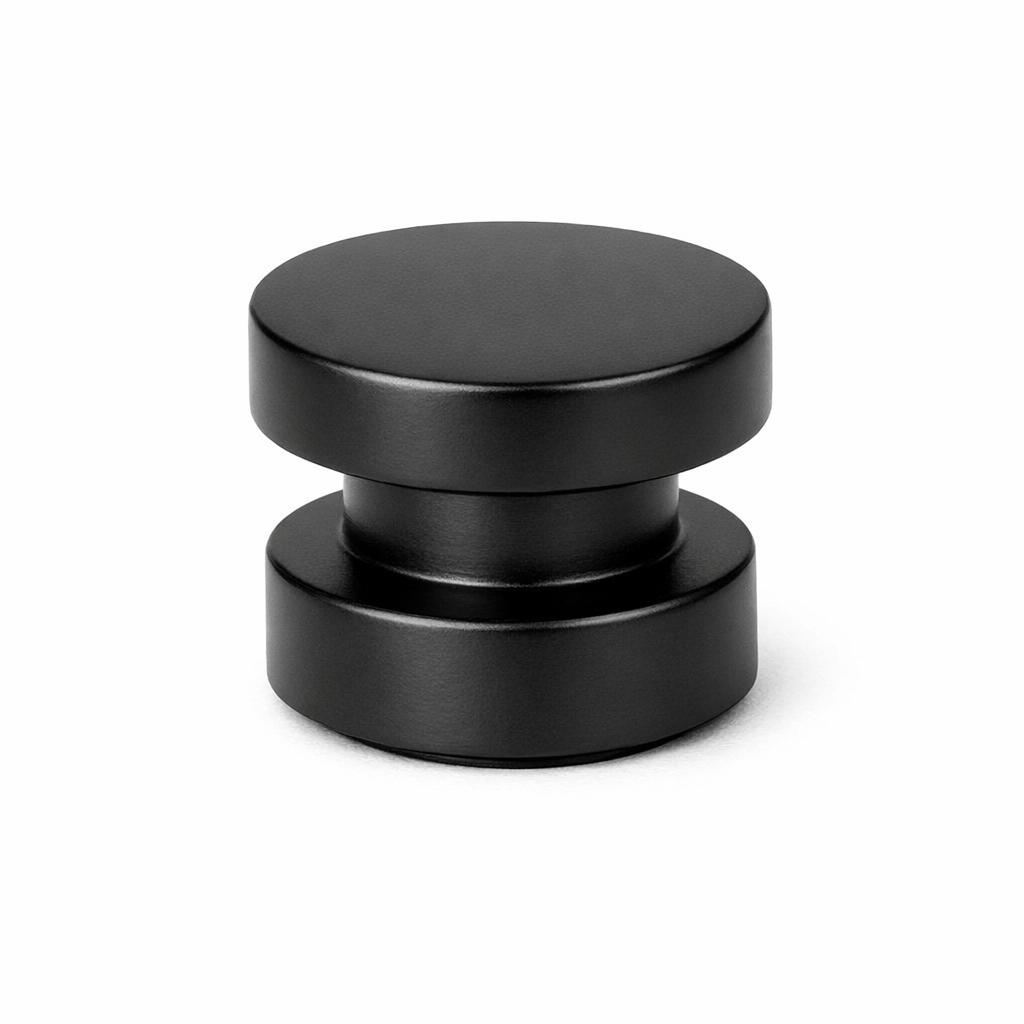 Commercial product photograph. A single residential cabinet knob. Smooth surface texture. Round Knob shape. Matte Black 