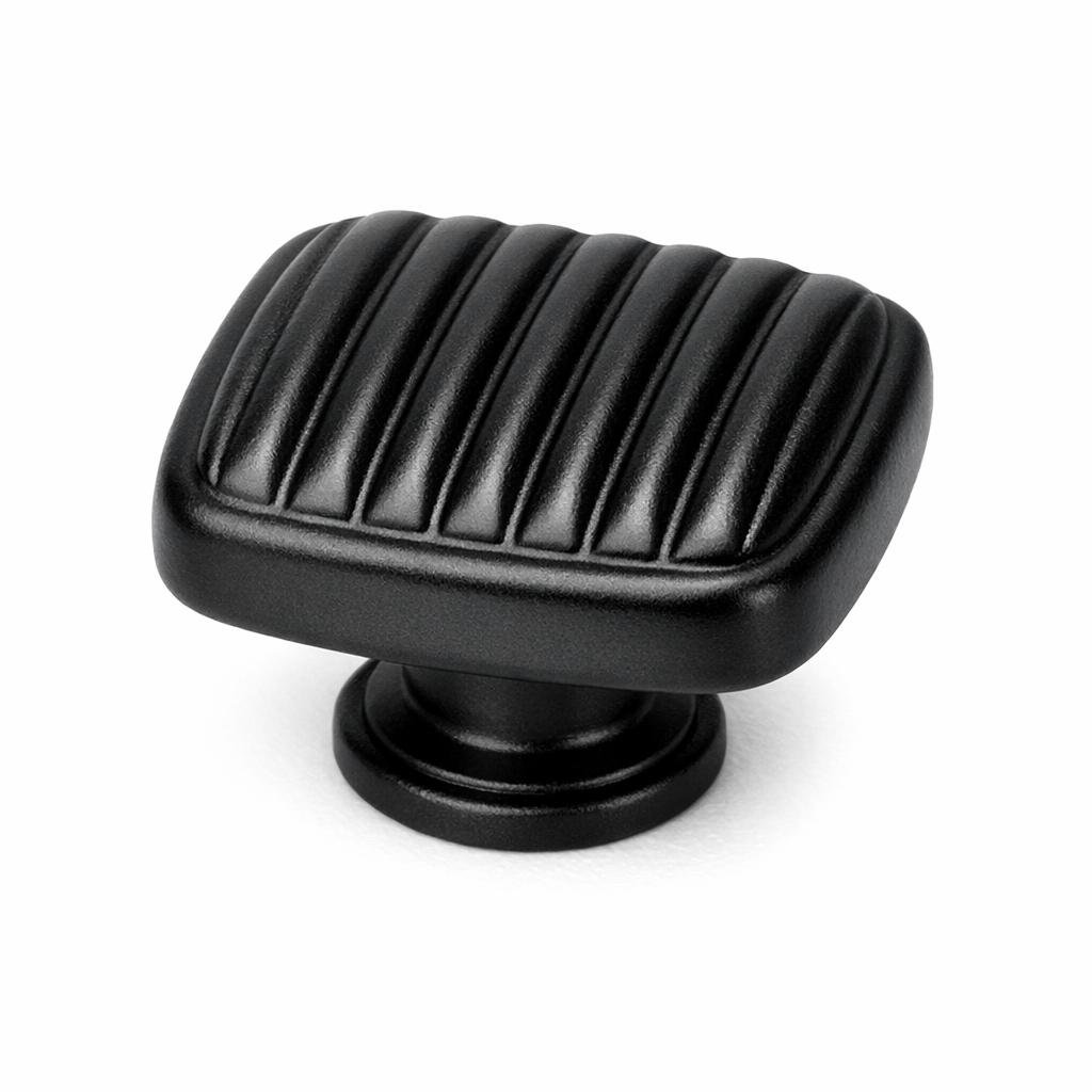 Commercial product photograph. A single residential cabinet knob. Ribbed surface texture. Round Knob shape. Matte Black 