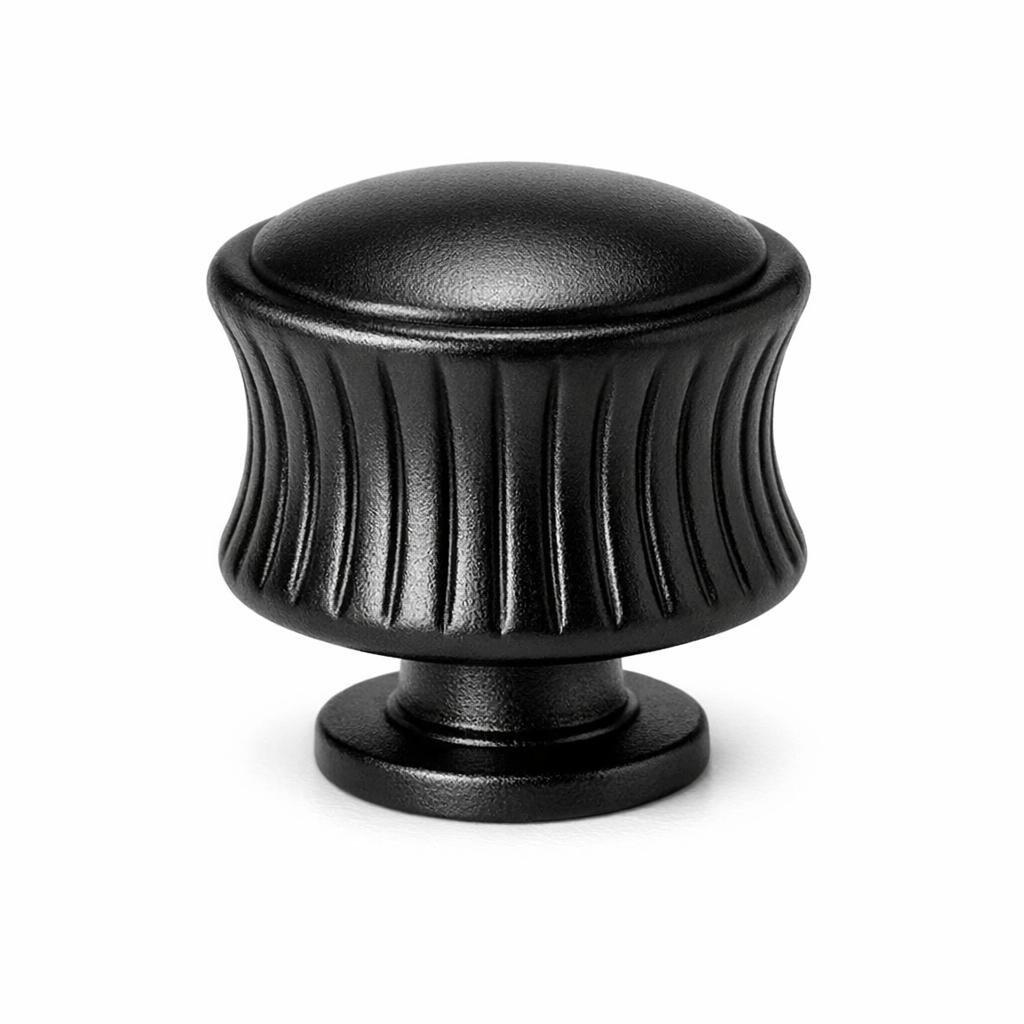 Commercial product photograph. A single residential cabinet knob. Ribbed surface texture. Round Knob shape....