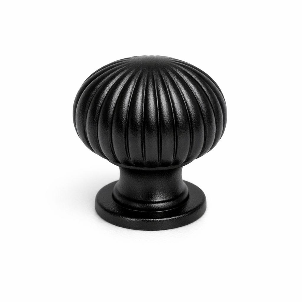 Commercial product photograph. A single residential cabinet knob. Ribbed surface texture. Round Knob shape....