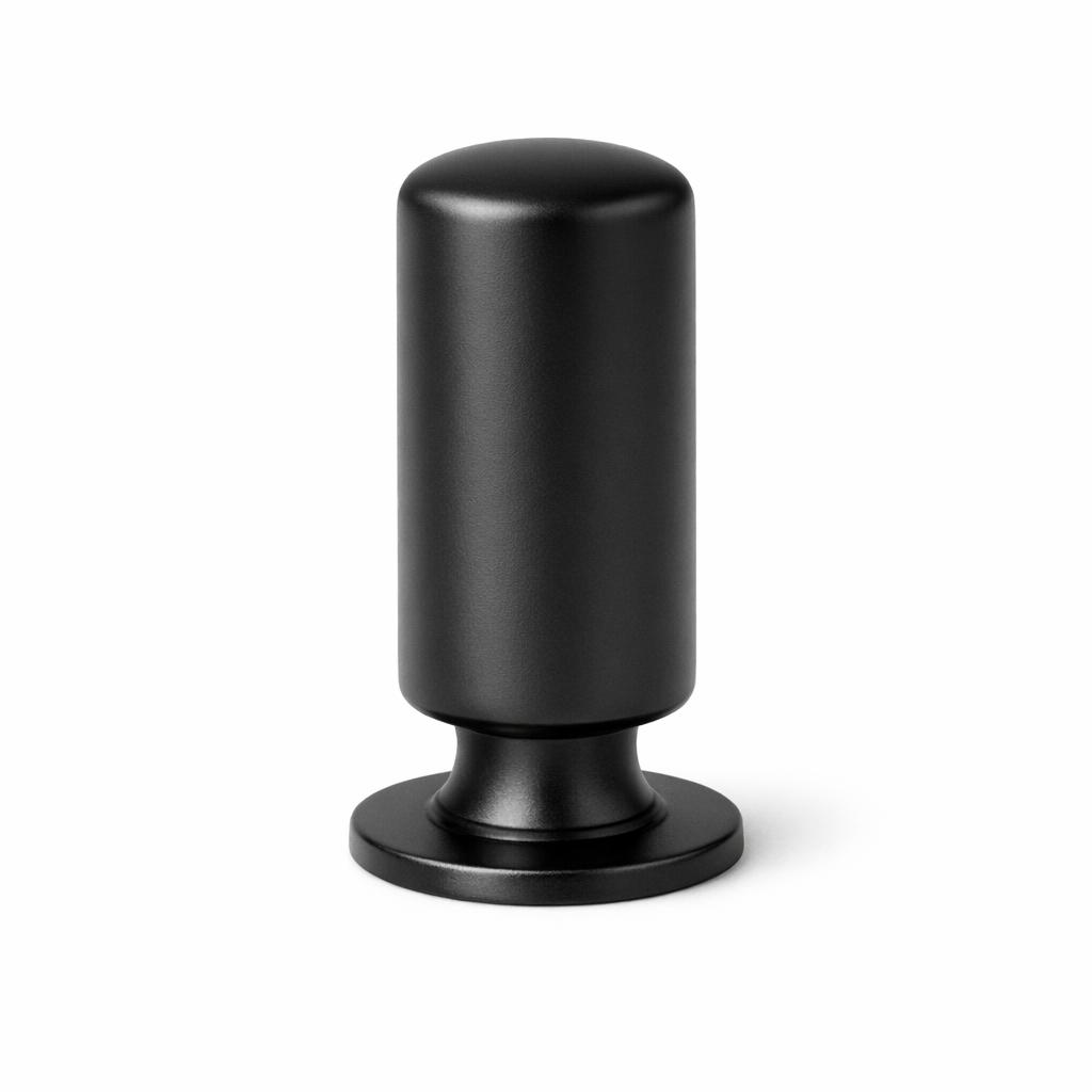 Commercial product photograph. A single residential cabinet knob. Smooth surface texture. Round Knob shape. Matte Black 