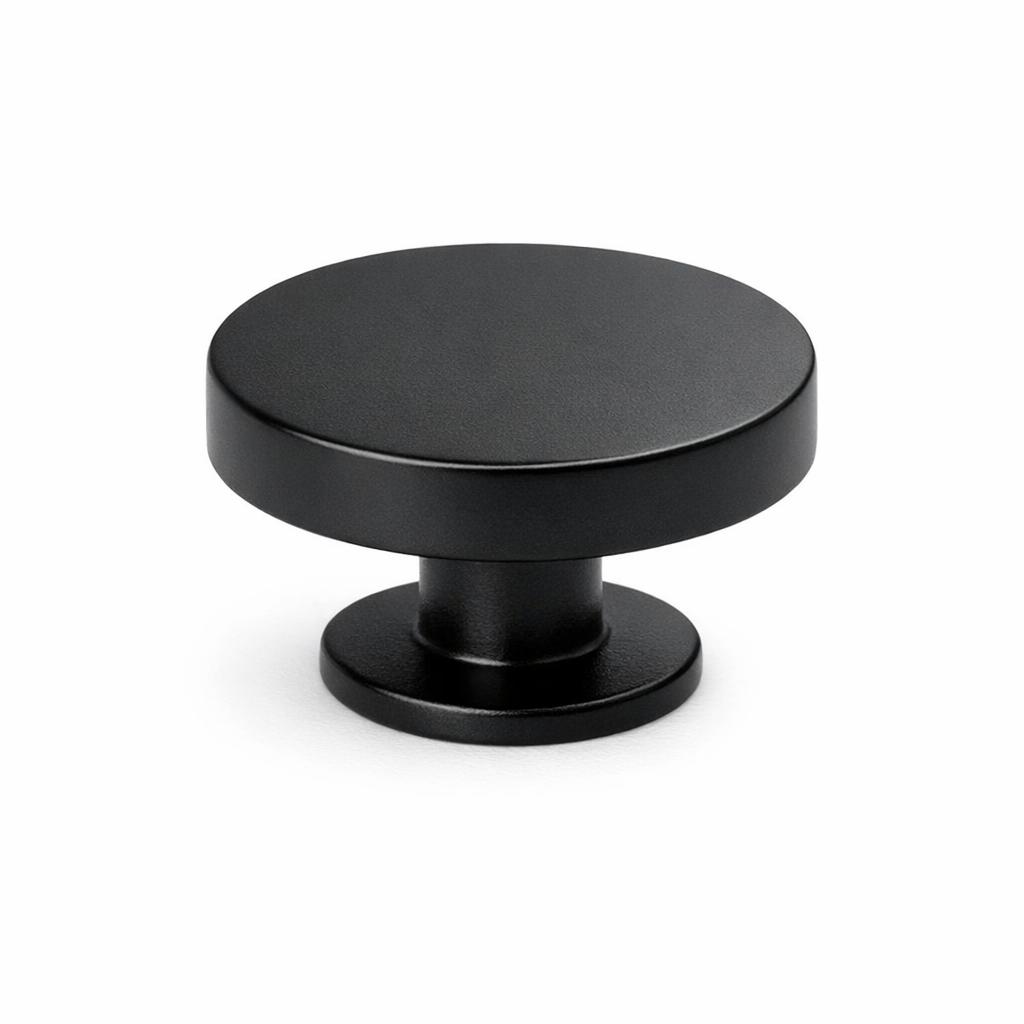 Commercial product photograph. A single residential cabinet knob. Smooth surface texture. Round Knob shape. Matte Black 