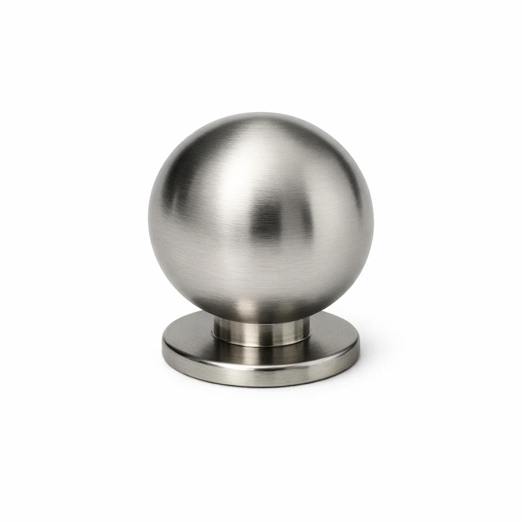 Commercial product photograph. A single residential cabinet knob. Smooth surface texture. Round Knob shape. Brushed Nickel metal finish. Small circular base plate, single mounting post, approximately 1-1/4 inch diameter. Photographed on pure white seamless background (#FFFFFF). Studio softbox lighting, soft shadow directly underneath only. Macro lens, sharp focus throughout. Photorealistic real metal hardware. Not a 3D render. Not an illustration. Not CGI. Real cabinet hardware product photography quality. Variation 3: Globe style cabinet knob: solid sphere ball shape, same diameter as the flat circular base ring, mid-century modern style. 1-1/8 inch diameter. Smooth surface, no texture, no ribbing, no decorative details..