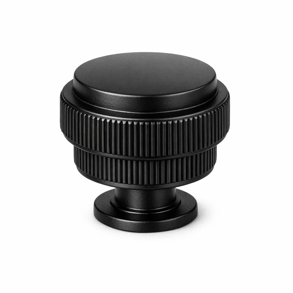 Commercial product photograph. A single residential cabinet knob. Ribbed surface texture. Round Knob shape....