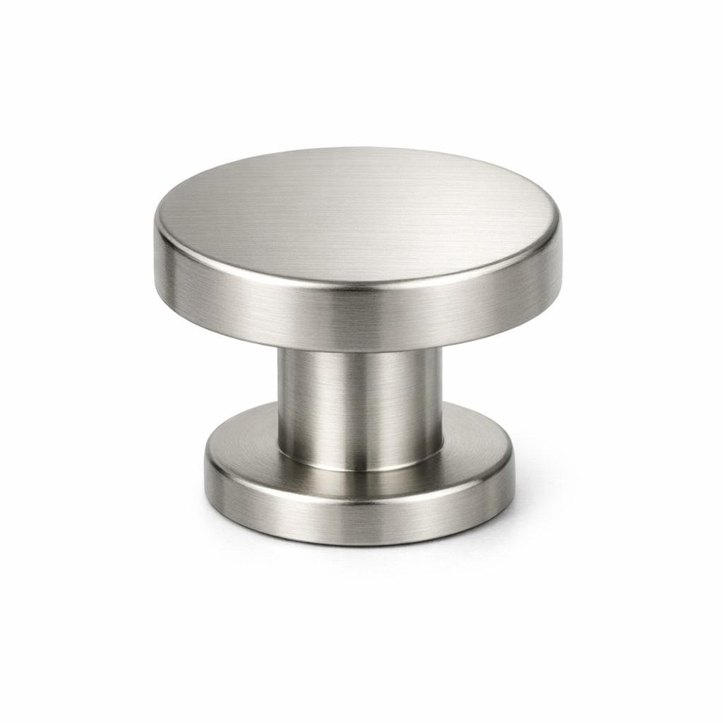 Commercial product photograph. A single residential cabinet knob. Smooth surface texture. Round Knob shape....