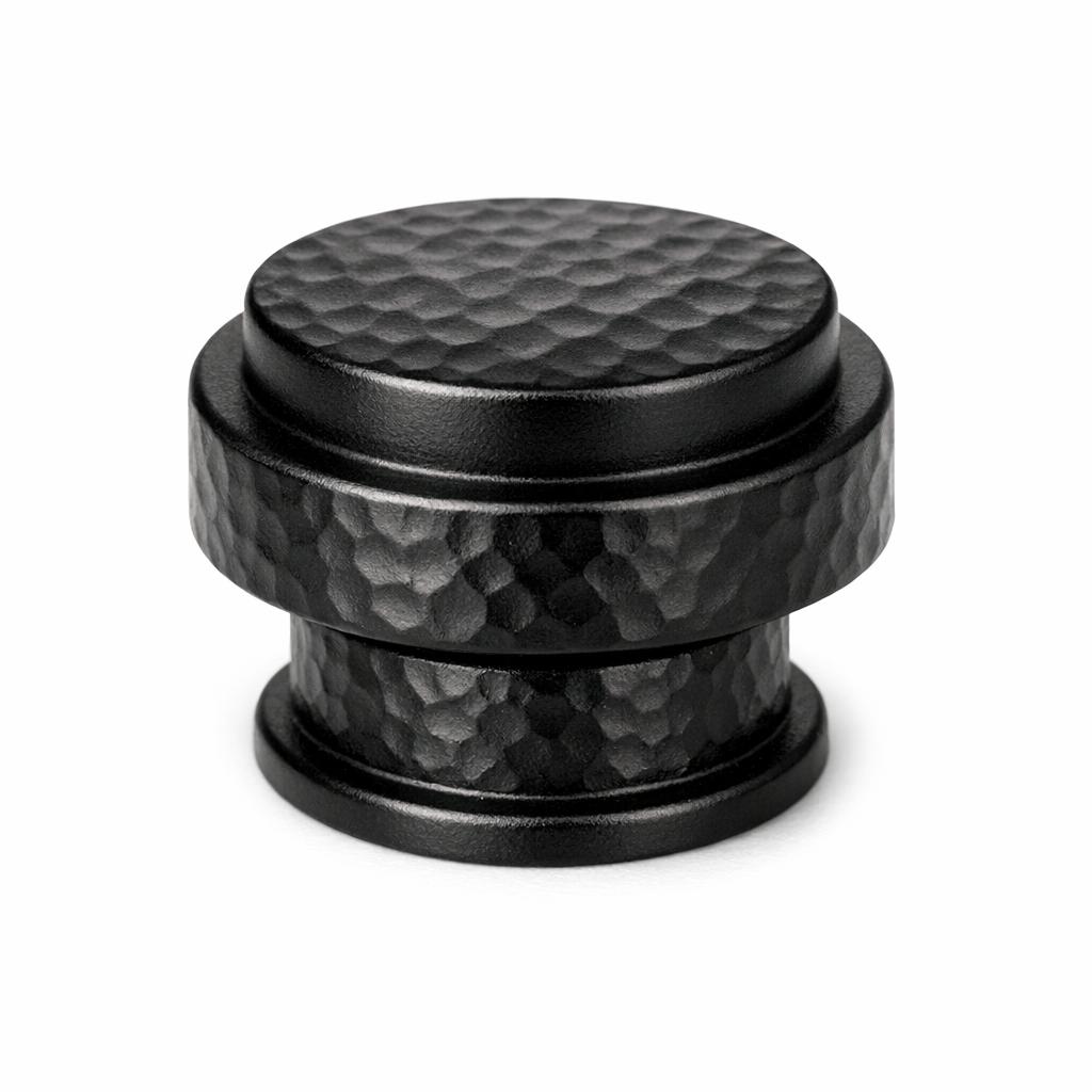 Commercial product photograph. A single residential cabinet knob. Hammered surface texture. Round Knob shap...