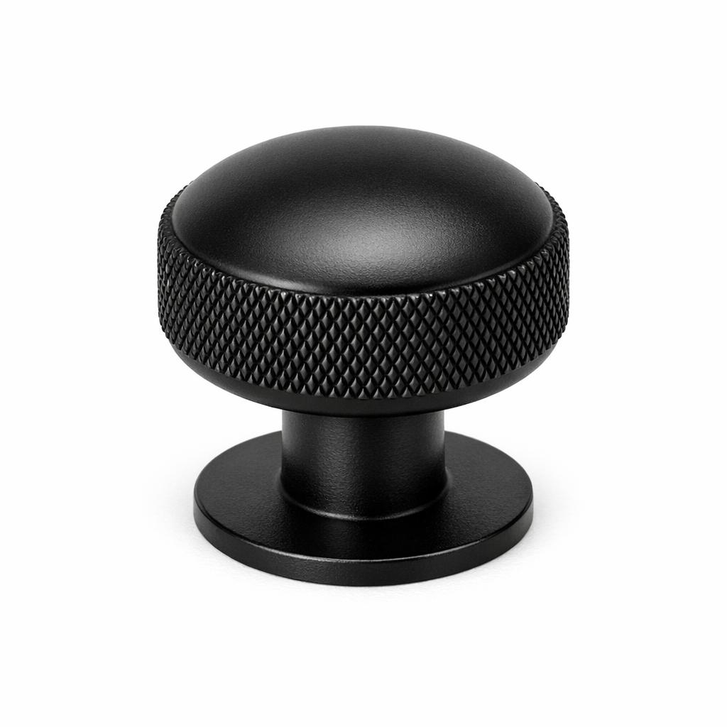 Commercial product photograph. A single residential cabinet knob. Knurled surface texture. Round Kno
