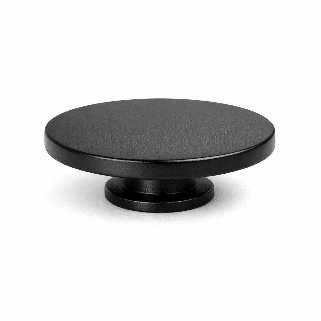 Commercial product photograph. A single residential cabinet knob. Smooth surface texture. Round Knob shape. Matte Black 