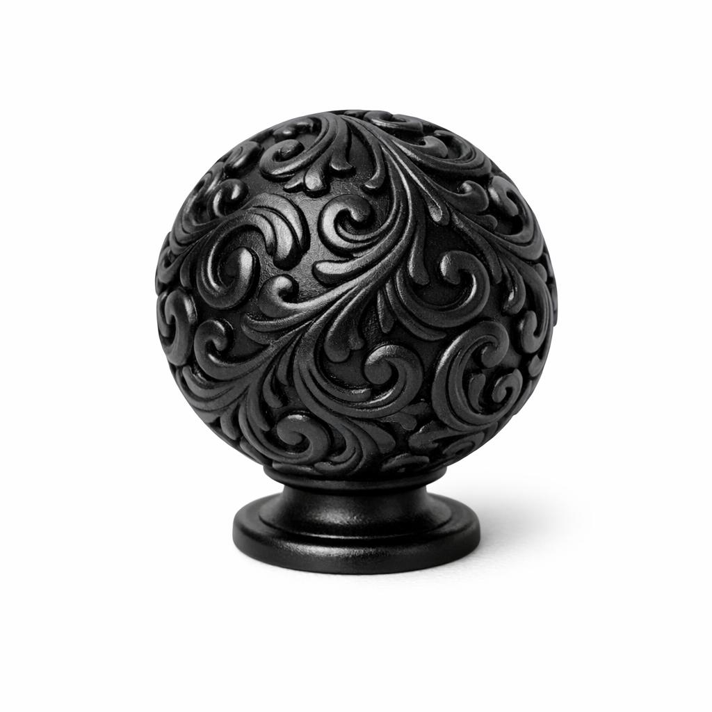 Commercial product photograph. A single residential cabinet knob. Scrollwork surface texture. Round Knob sh...
