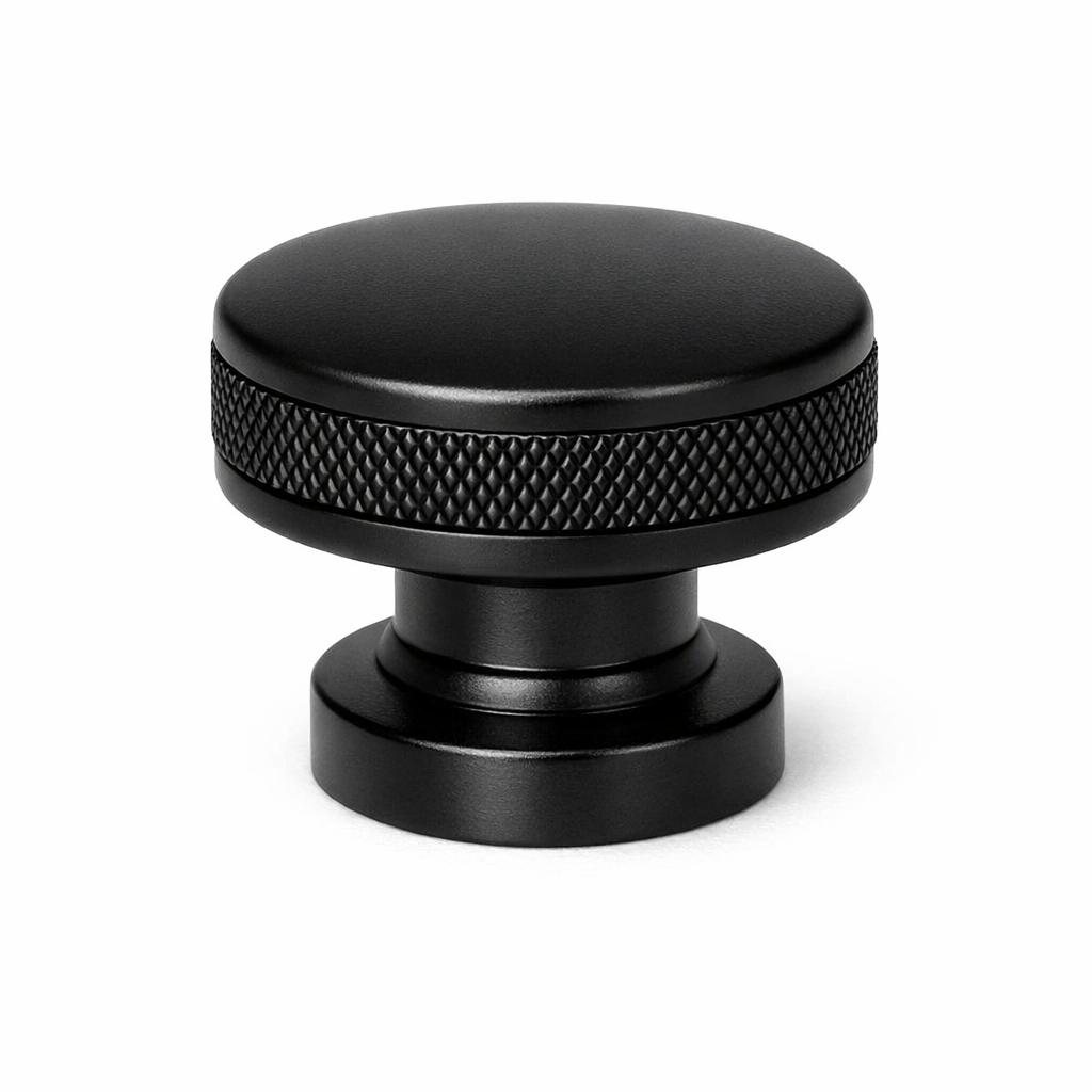 Commercial product photograph. A single residential cabinet knob. Knurled surface texture. Round Kno