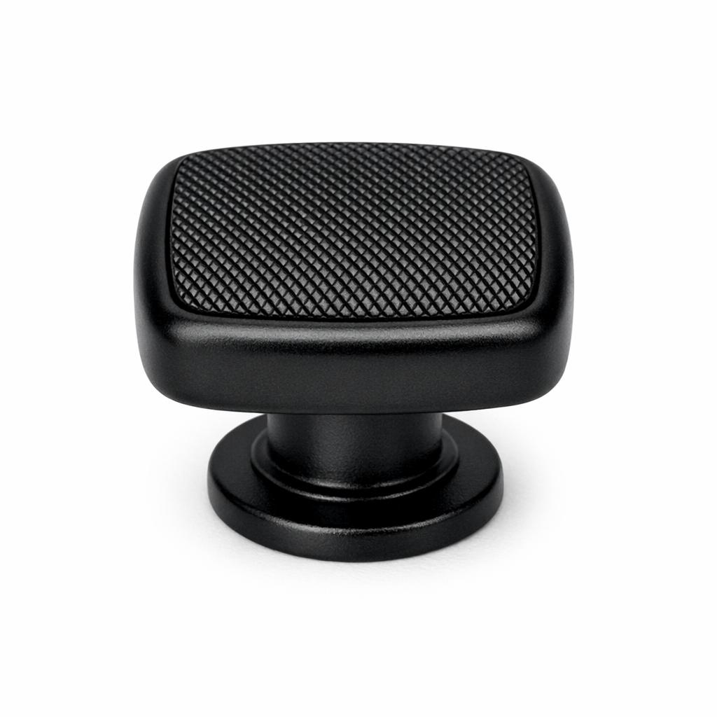 Commercial product photograph. A single residential cabinet knob. Knurled surface texture. Round Kno