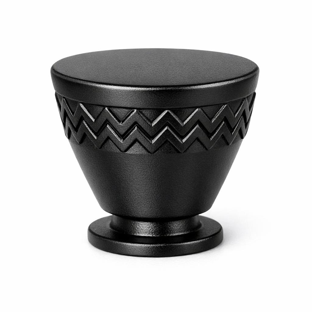 Commercial product photograph. A single residential cabinet knob. Geometric surface texture. Round K