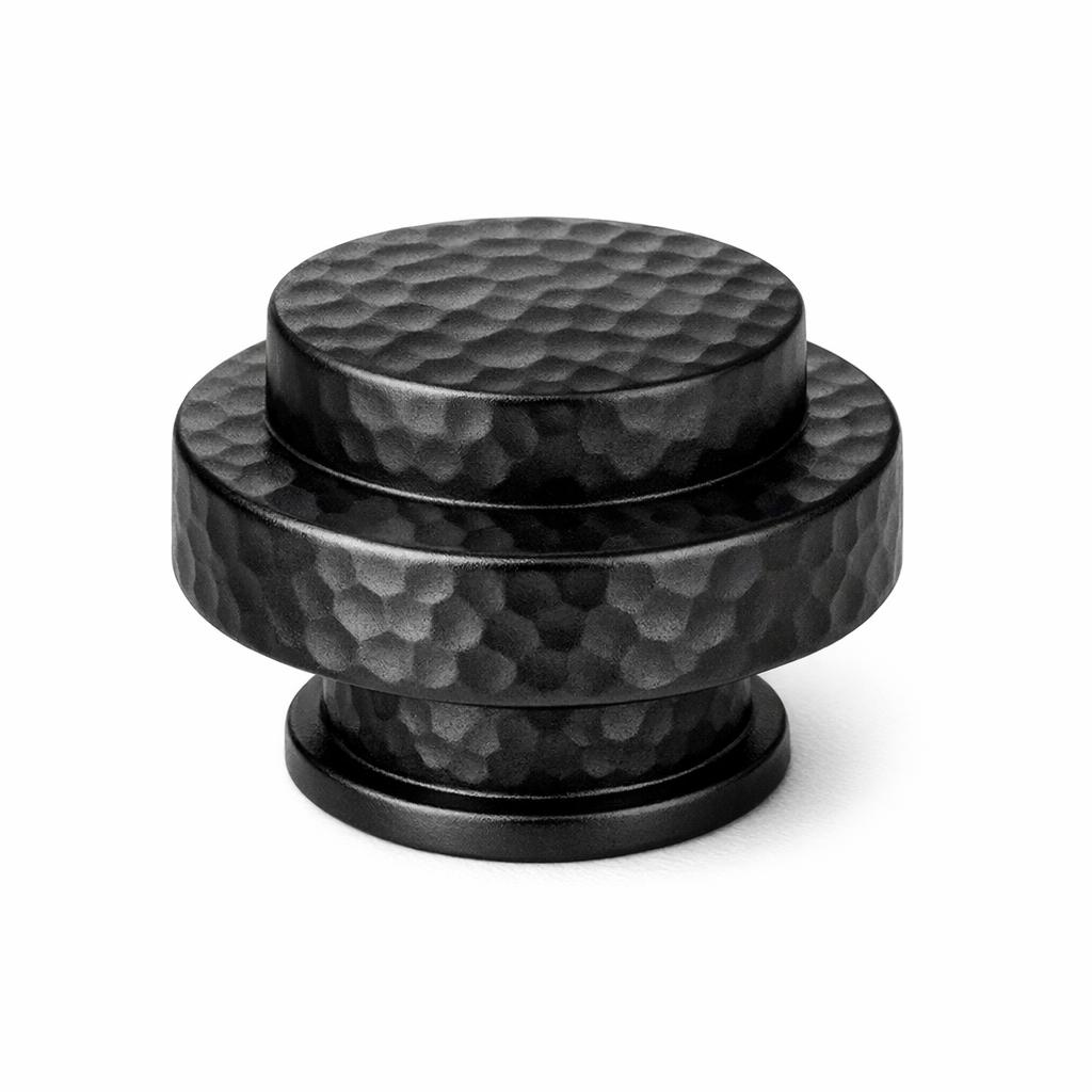 Commercial product photograph. A single residential cabinet knob. Hammered surface texture. Round Kn