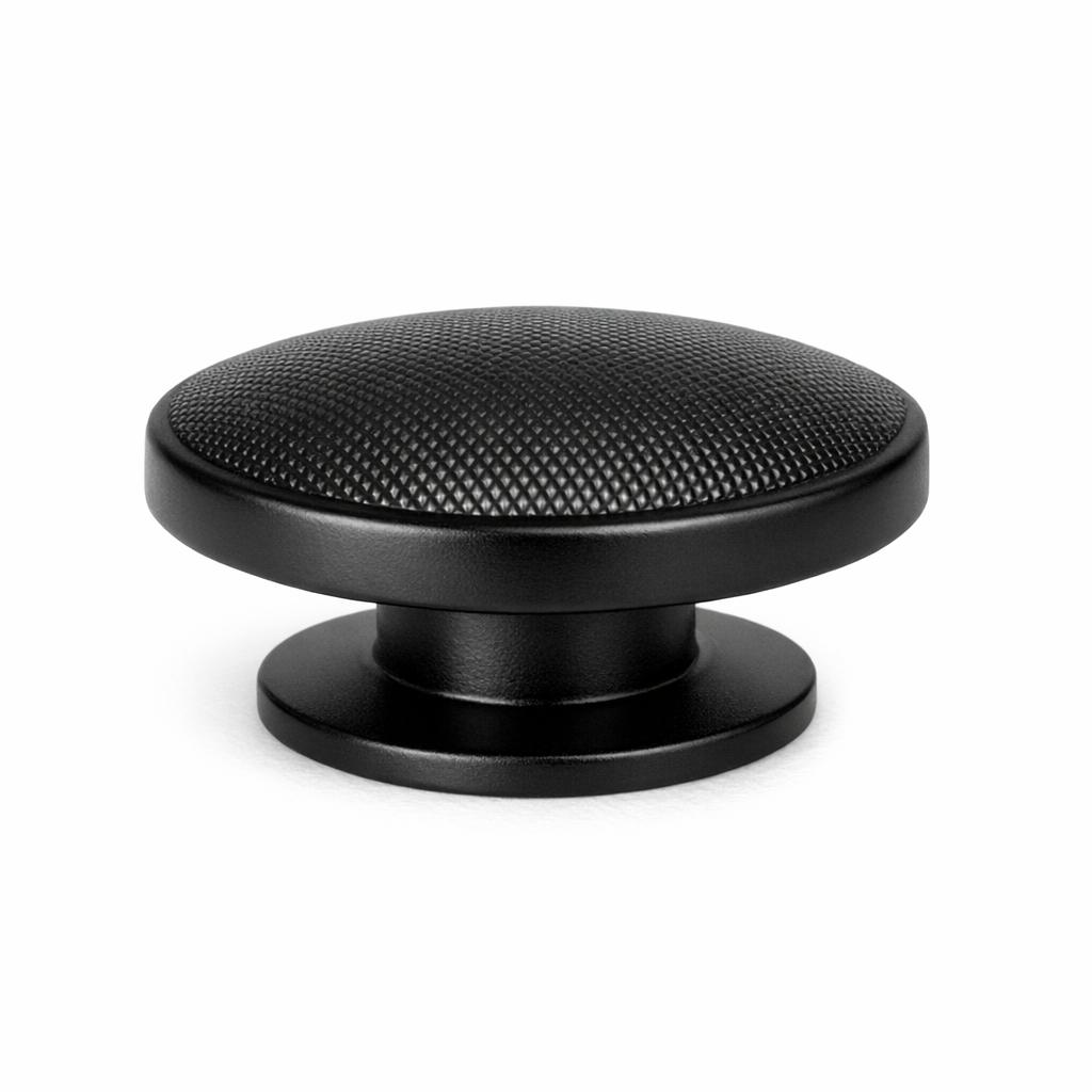 Commercial product photograph. A single residential cabinet knob. Knurled surface texture. Round Kno