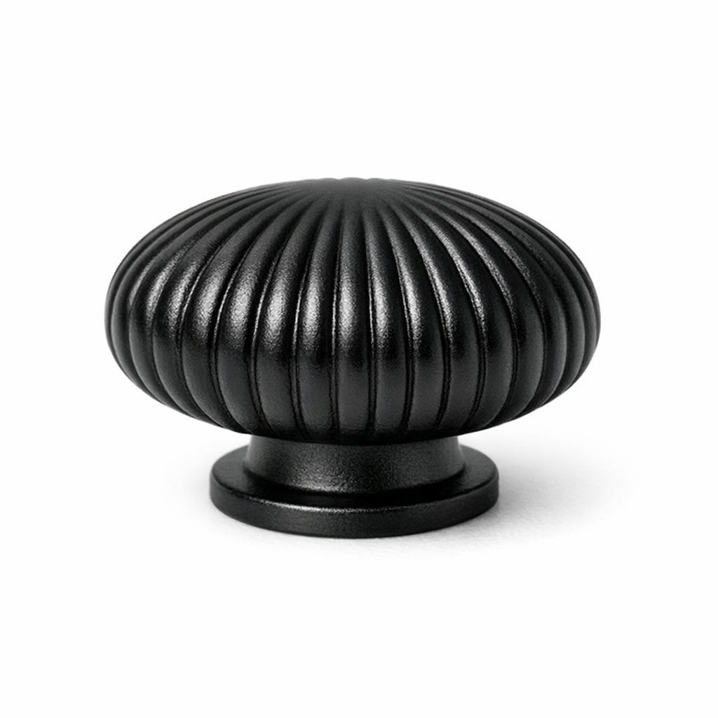 Commercial product photograph. A single residential cabinet knob. Ribbed surface texture. Round Knob shape....