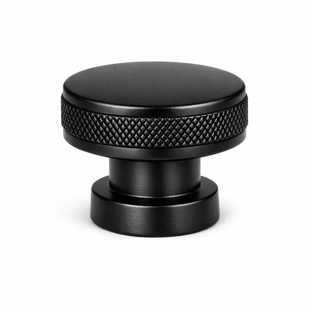 Commercial product photograph. A single residential cabinet knob. Knurled surface texture. Round Knob shape...