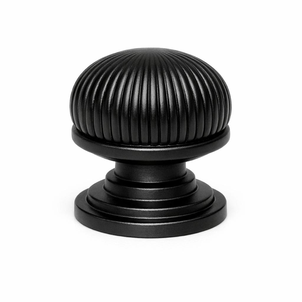 Commercial product photograph. A single residential cabinet knob. Ribbed surface texture. Round Knob shape. Matte Black 