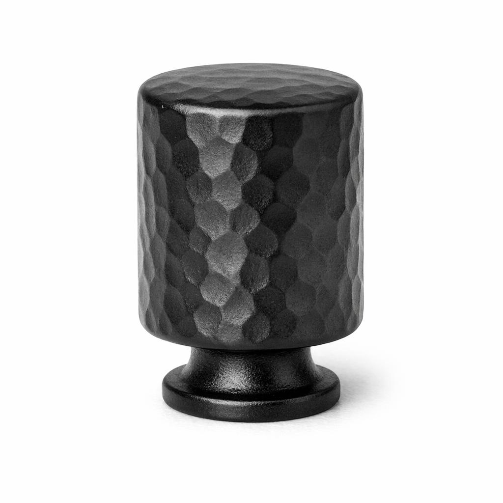 Commercial product photograph. A single residential cabinet knob. Hammered surface texture. Round Kn