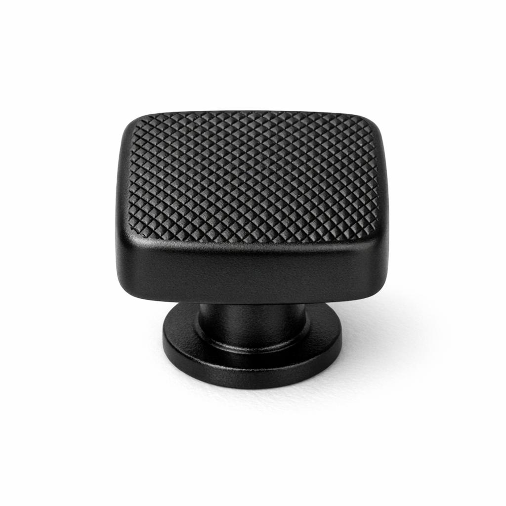 Commercial product photograph. A single residential cabinet knob. Knurled surface texture. Round Knob shape. Matte Black