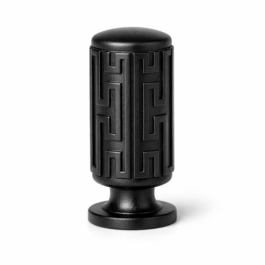 Commercial product photograph. A single residential cabinet knob. Geometric surface texture. Round K