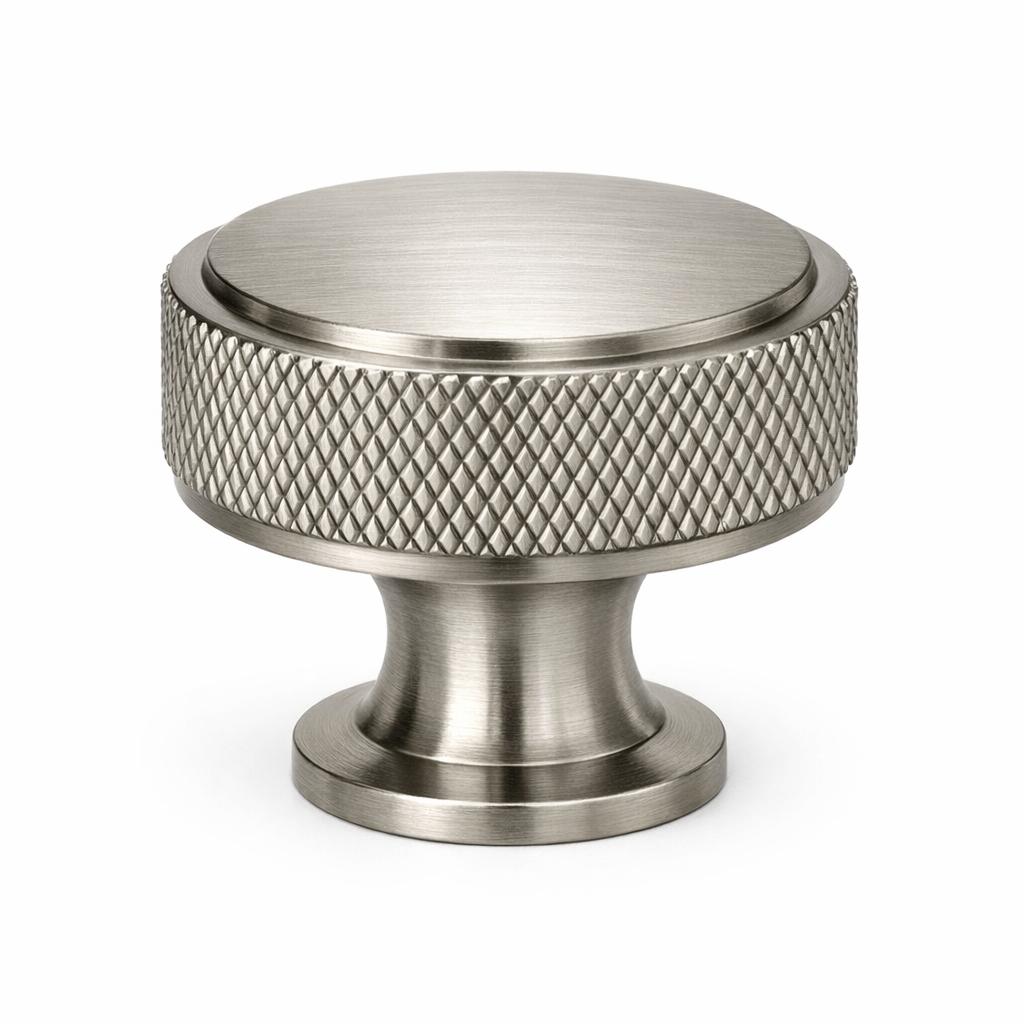 A single product photograph of a Knurled Round Knob cabinet knob in Brushed Nickel finish. Shot straight-on...