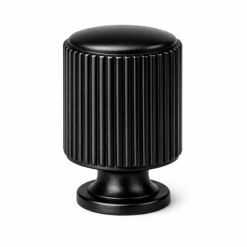 Commercial product photograph. A single residential cabinet knob. Ribbed surface texture. Round Knob shape....